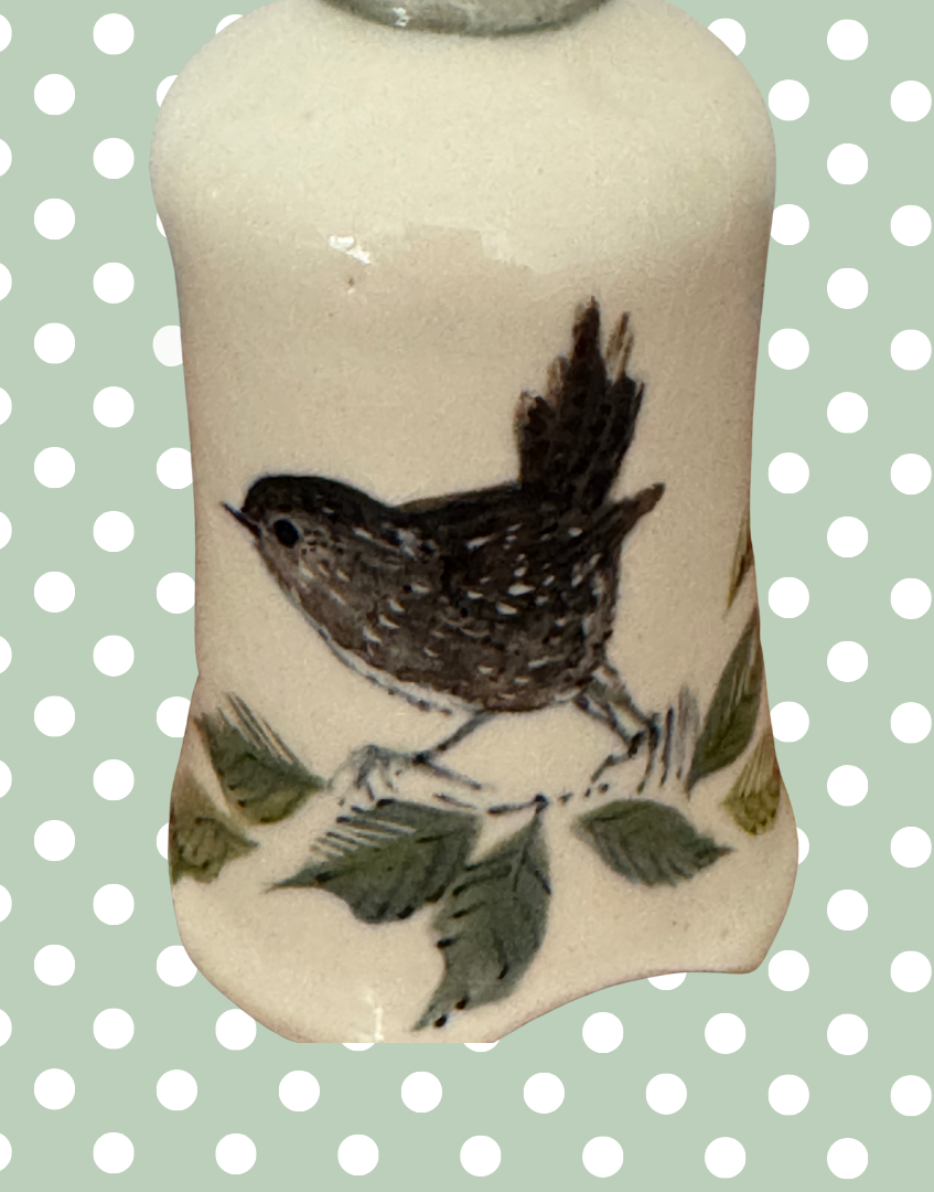 close up of charming british heritage wren llustration on vintage cermic pie bird