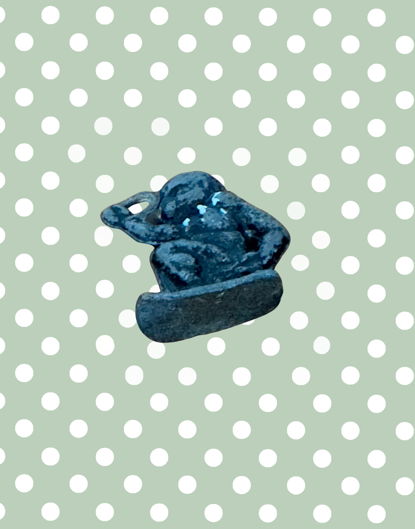 underside of miniature black hand painted britains monkey figurine