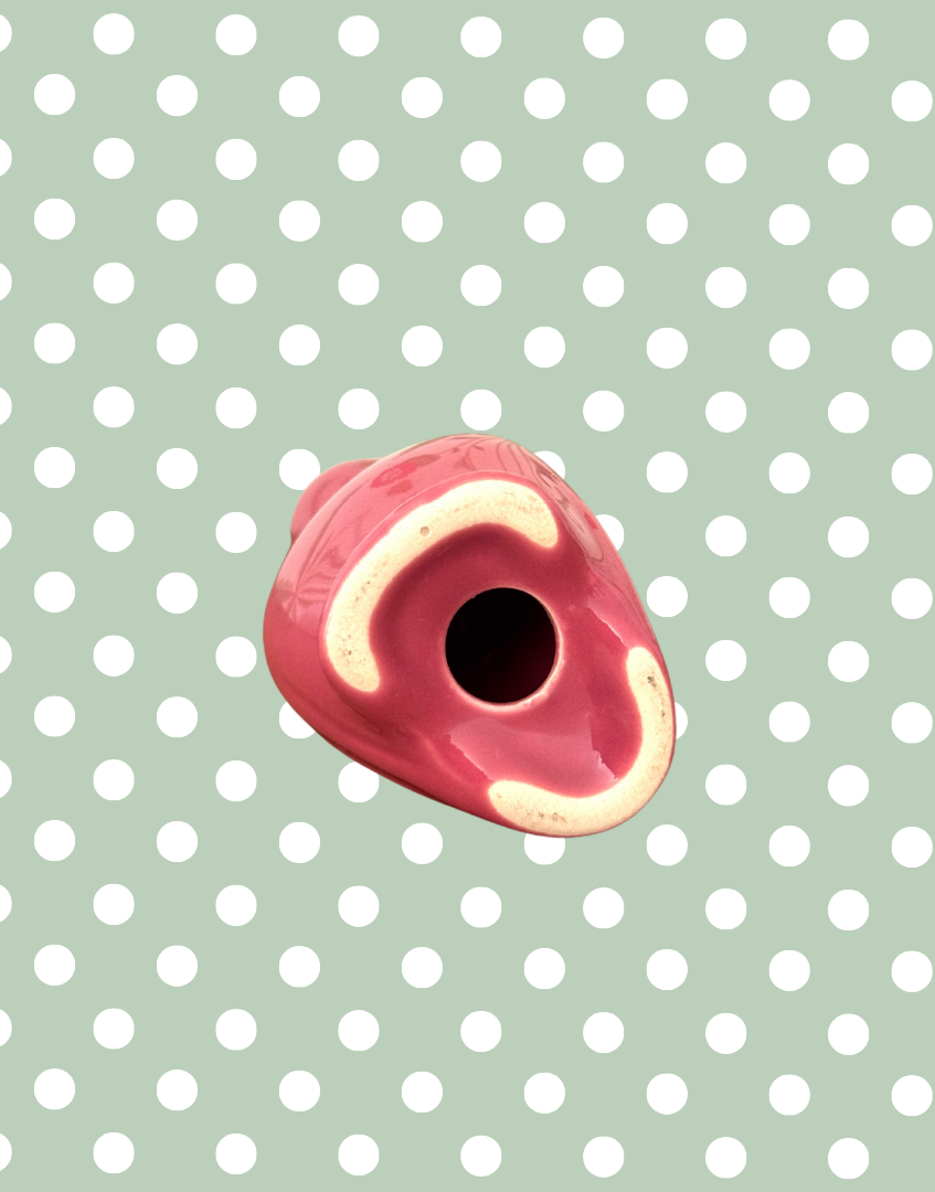 Underside view of pink collectable pie bird