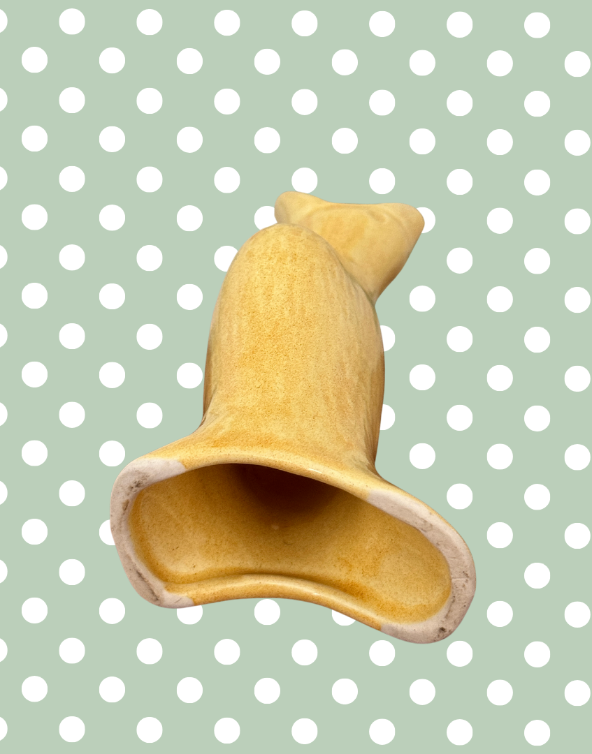 Base view of classic yellow vintage pie bird baking tool