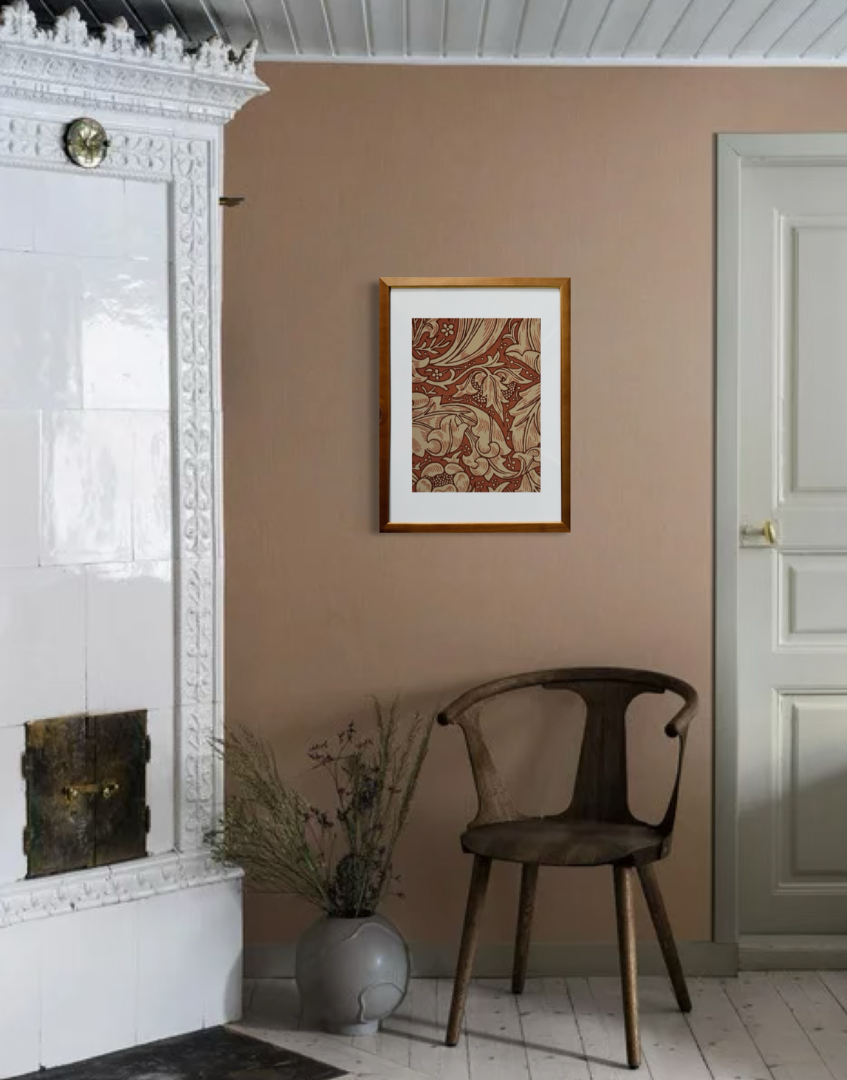 white and terracotta interior with simple chair and william morris bachelors button framed print