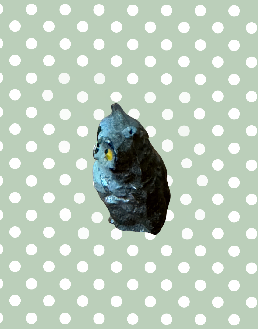 side view of rare miniature lead owl figurine