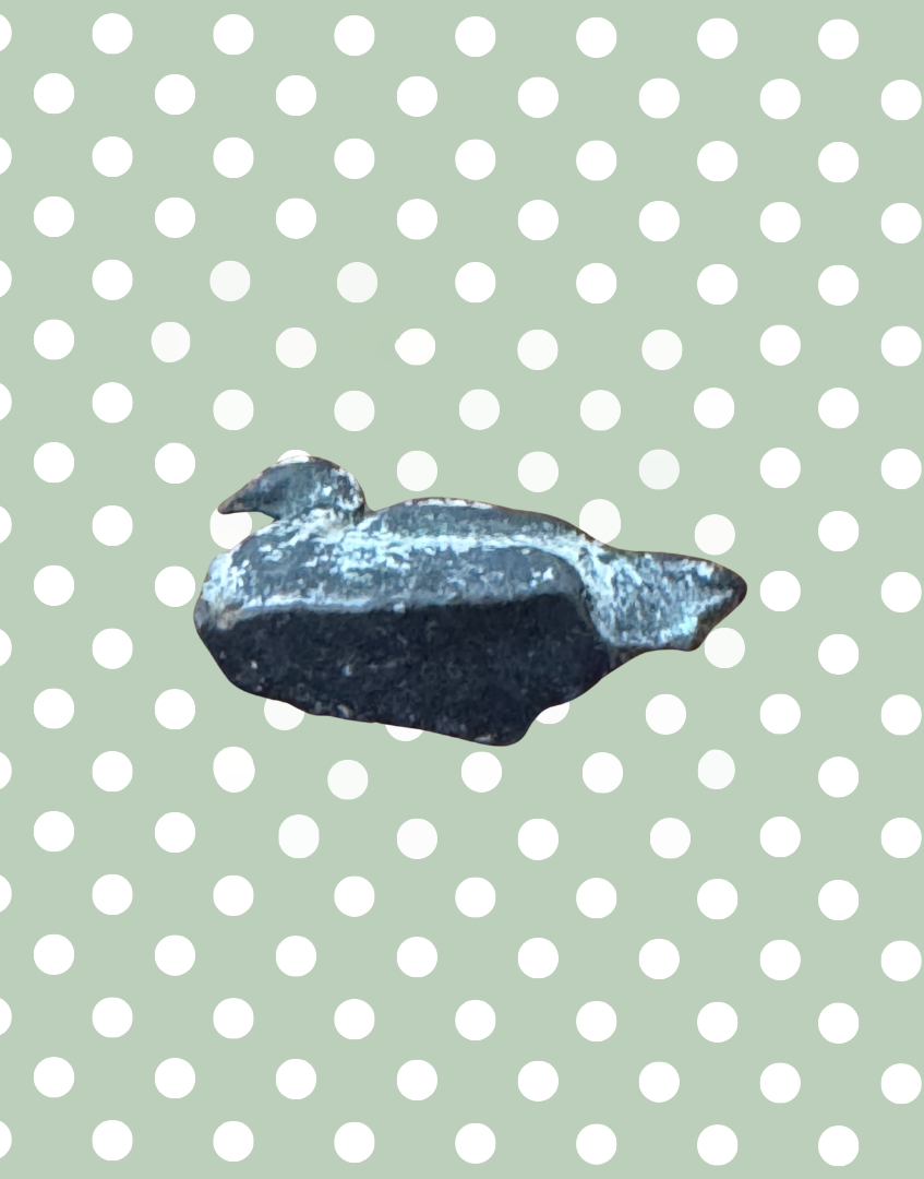 underside of hollow cast lead miniature goose figure