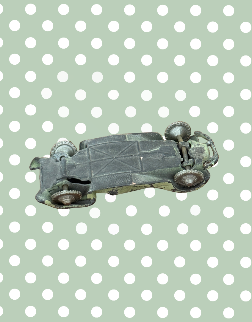 Underside view of vintage Britains lead toy car base