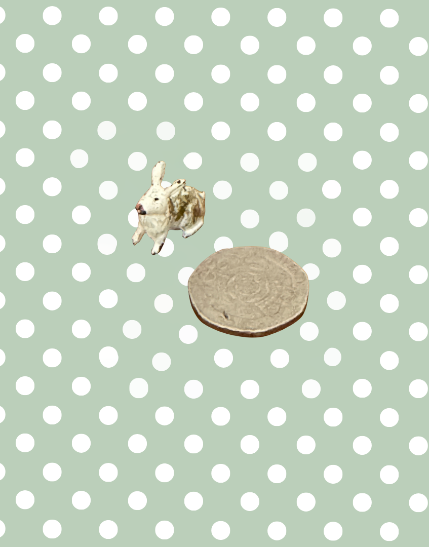 Miniature Vintage Britains Farm Animals Rabbit Next to Twenty Pence Piece for Idea of Scale