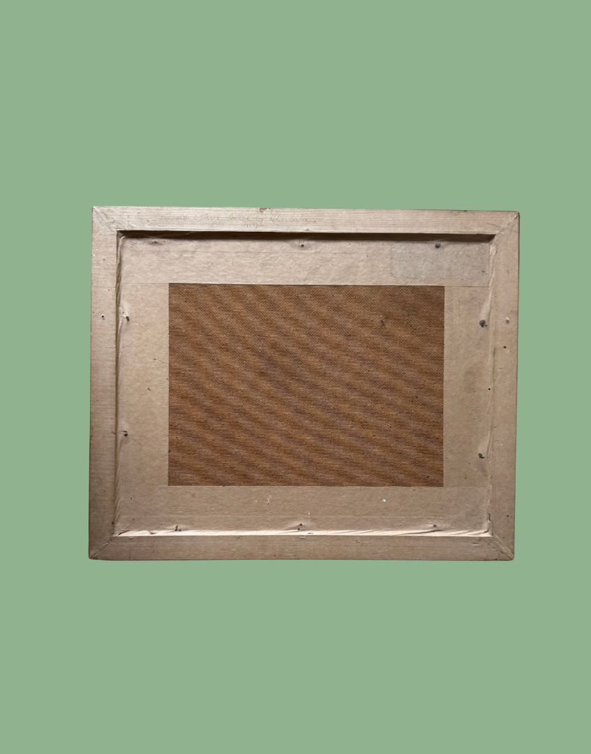 Back of wooden picture frame on a green background