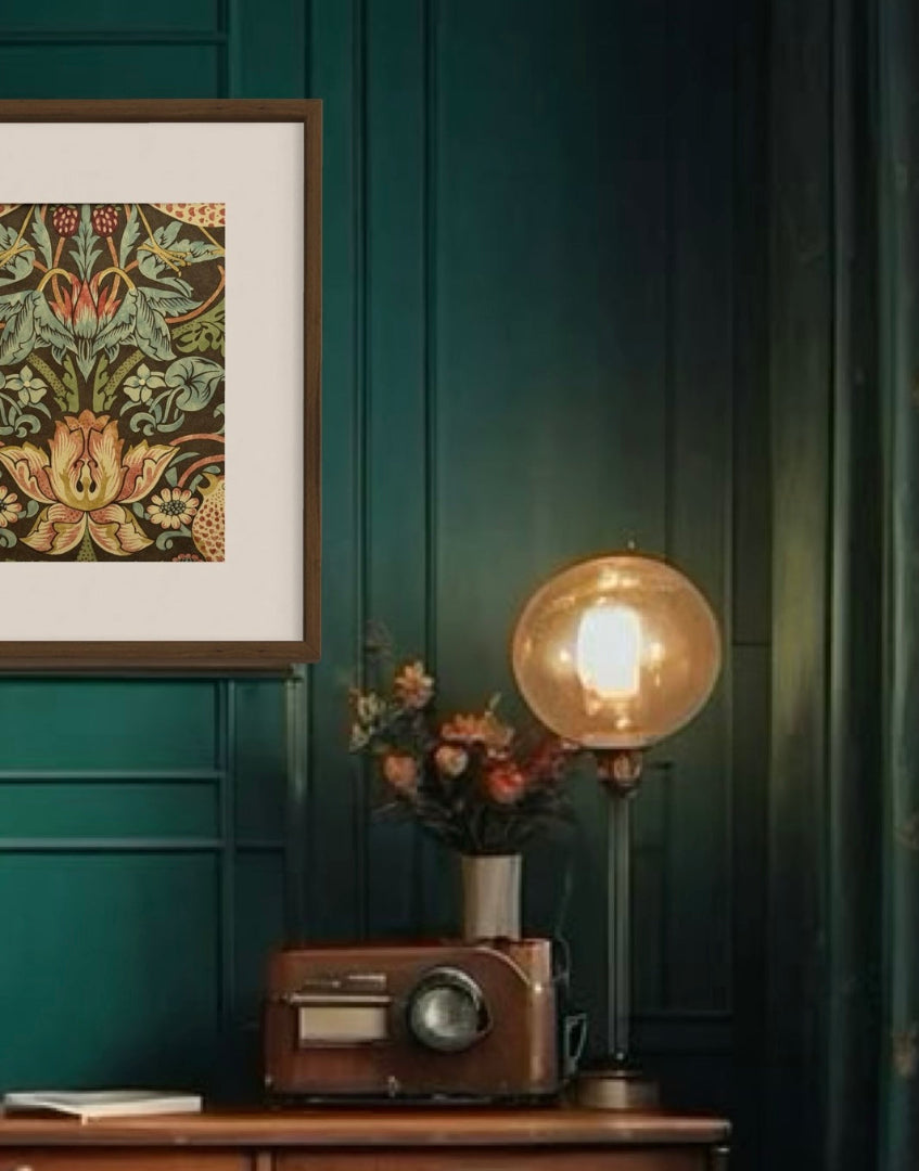 Colour drench green bohemian interior with wood framed William Morris framed print on wall