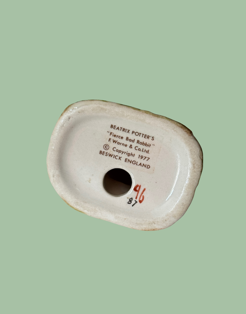 The underside of a ceramic figurine base, showing printed text 'BEATRIX PORTER'S "Force, Bad Rabbit" f Warner & Co.Ltd.