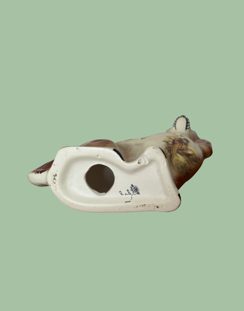 base and stamp of Arthur Wood Devon pottery on underside of vintage stafforsdshire dog ceramic figurine