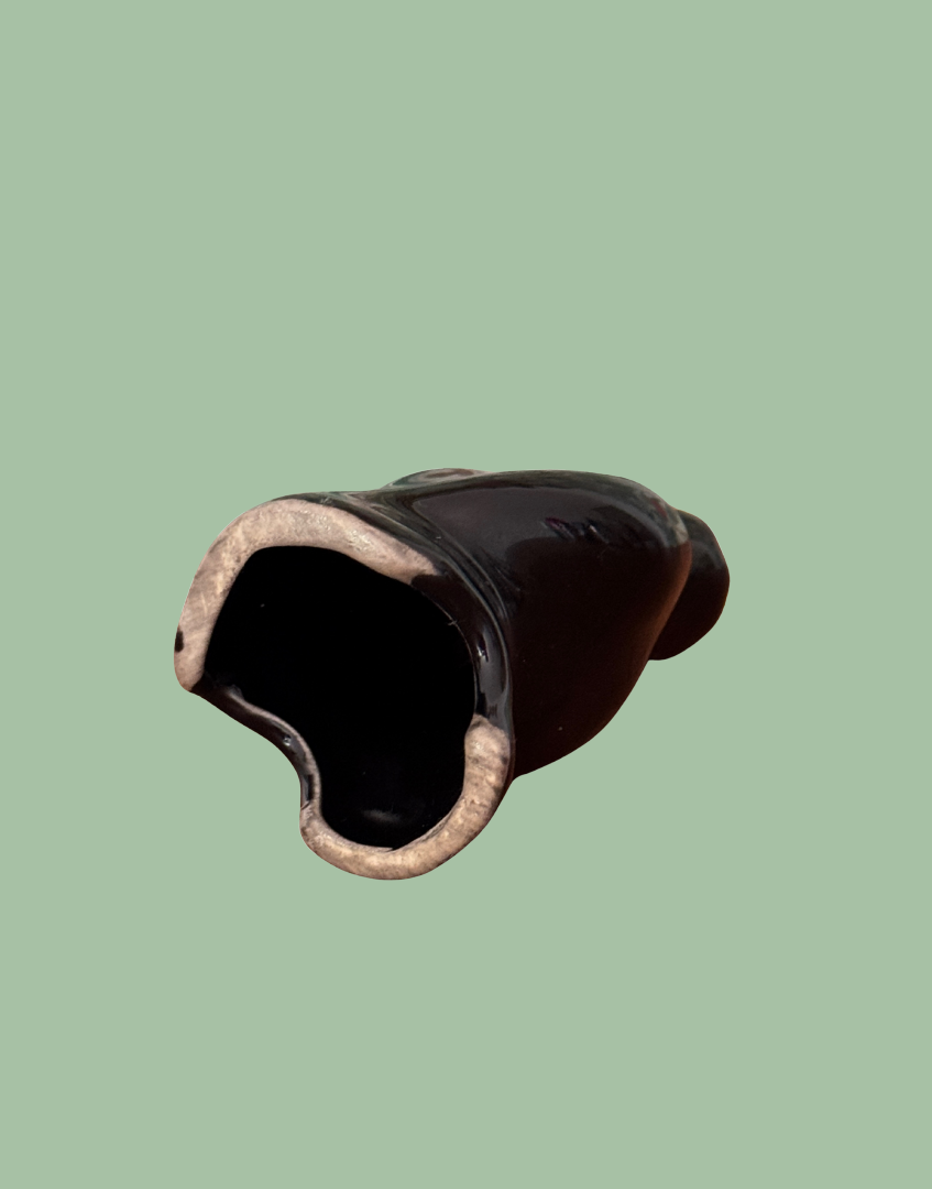 Underside view of black bird vinatge ceramic pie funnel