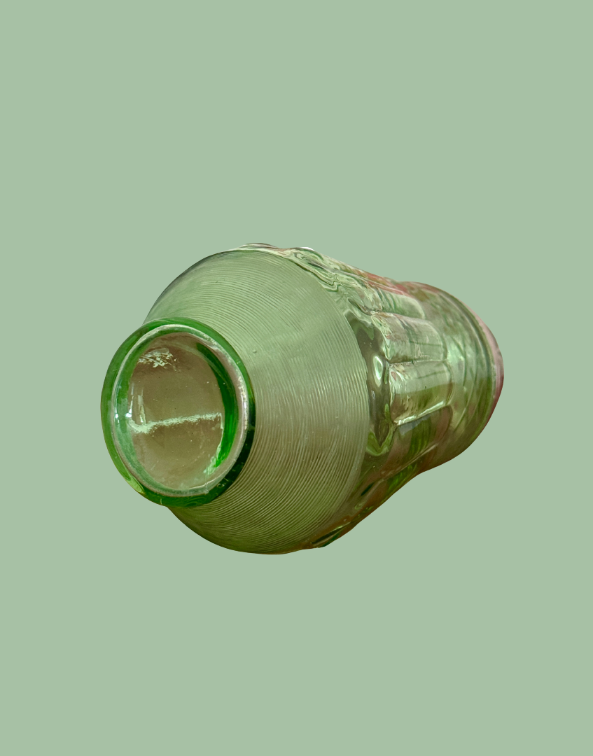 Base view of green glass detail on collectable vintage sugar shaker