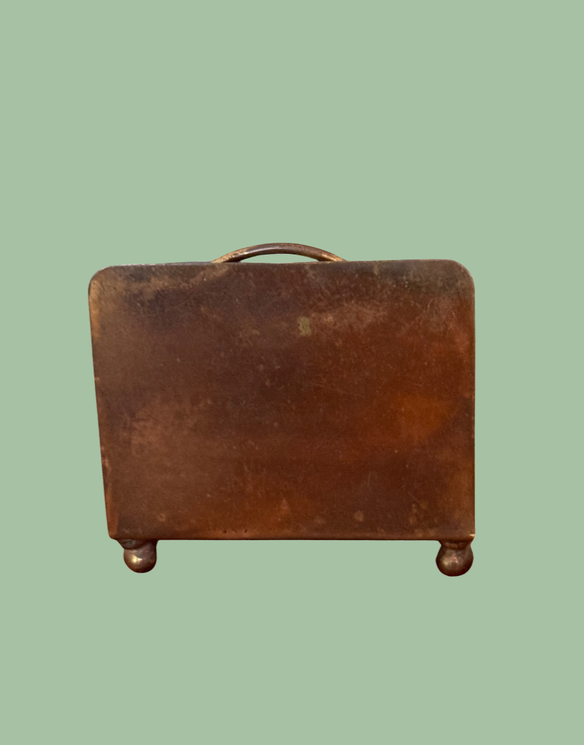 Back view of brass vintage letter rack