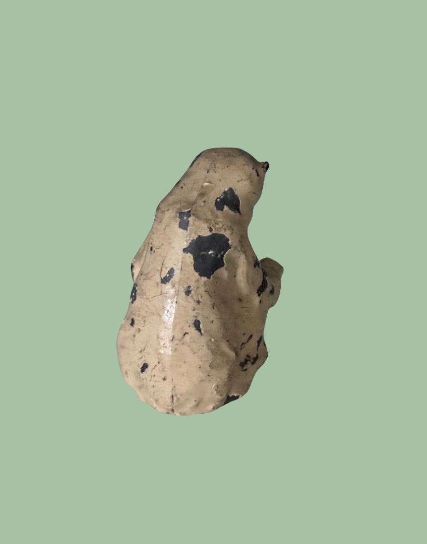 close up of paint loss on vintage polar bead lead figurine