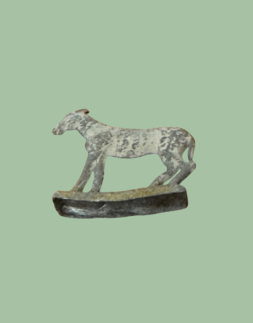 underside of miniature vintage lead britains goat figurine on stand