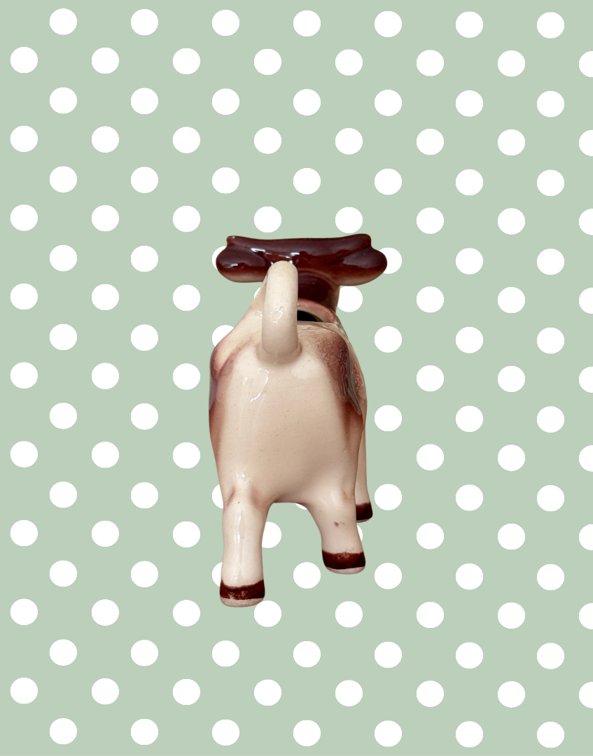 Rear view of cow creamer with tail as handle