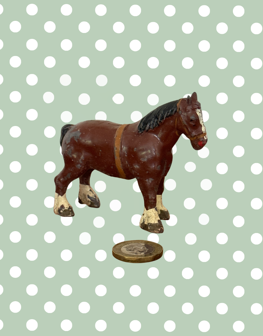 classic chestnut brown britains cart horse lead toy collectable by one pound coin for scale