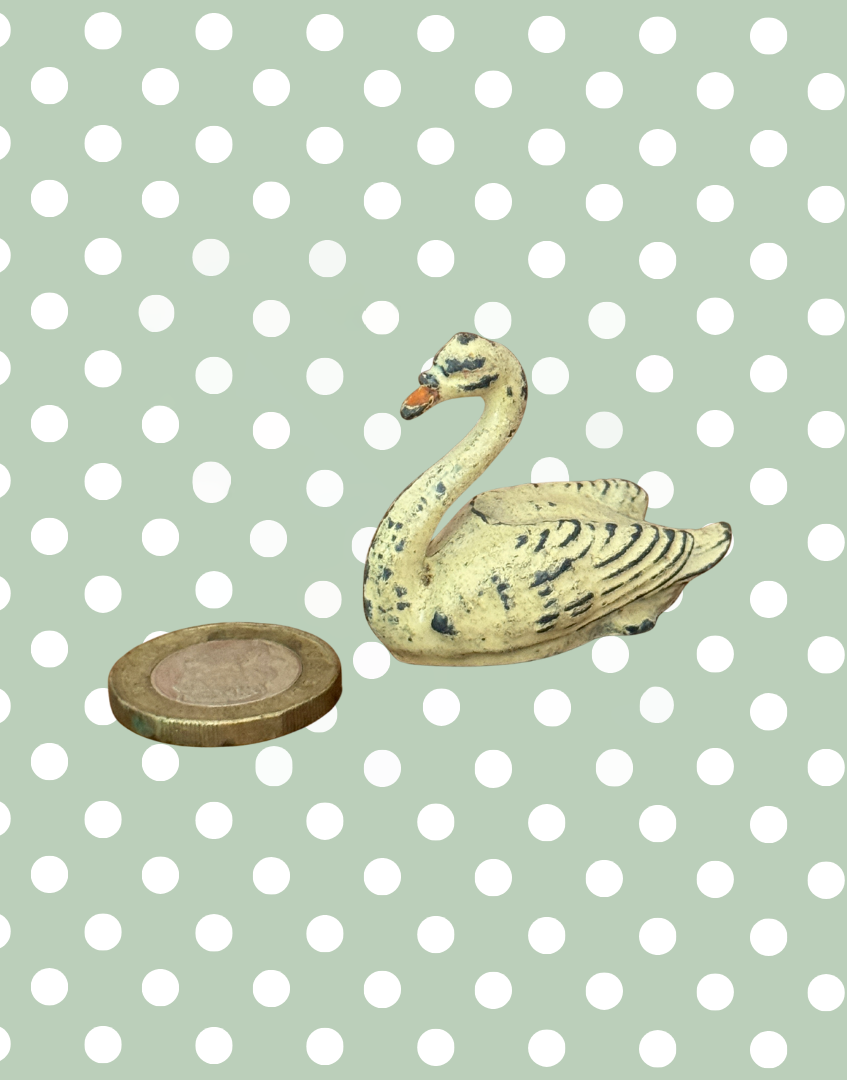 britains miniature antique swan british toy collectable next to one pound coin for scale