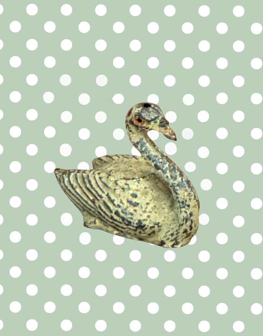 A cream swan swimming, version 2, showing some paint loss but retaining delicate shape and charm. This 1920s Britains figure is an ideal addition for collectors completing a vintage farmyard or waterfowl display.