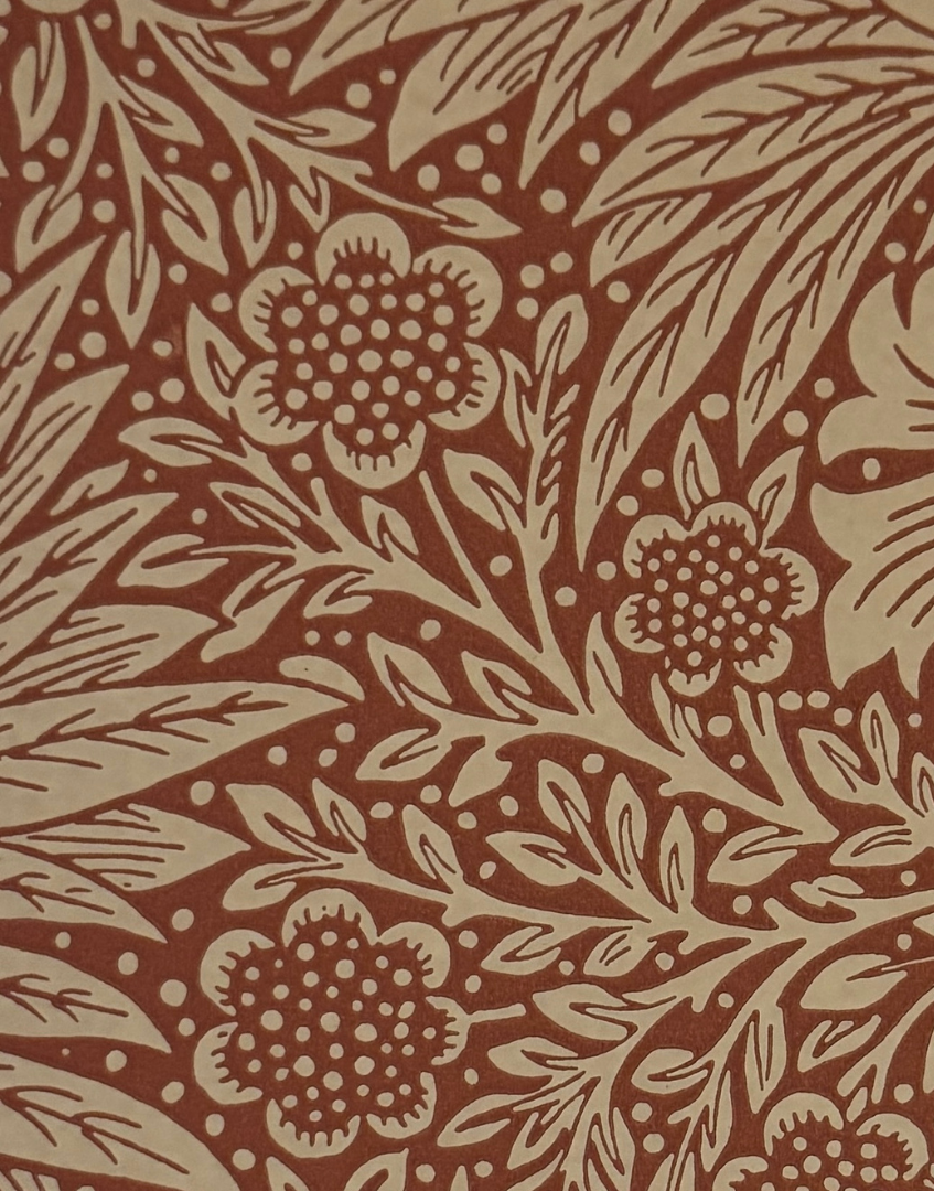 Decorative floral pattern with beige flowers and leaves on a brown background