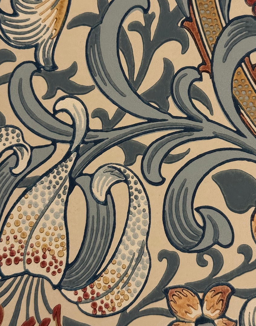 Close-up of a detailed floral pattern with gray, brown, and beige colors on a beige background.