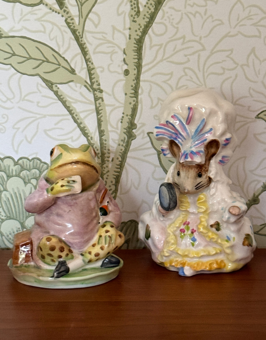 Vintage Beswick Lady Mouse and Jeremy Fisher Beatrix Potter figurines displayed together on a shelf as part of a charming English pottery collection