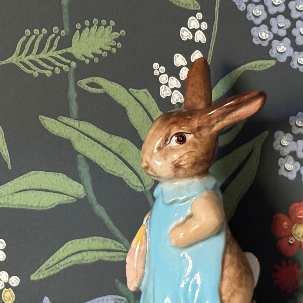 Vintage Beswick Beatrix Potter Mrs Bunny cottagecore style figurine against heriatge floral wallpaper background