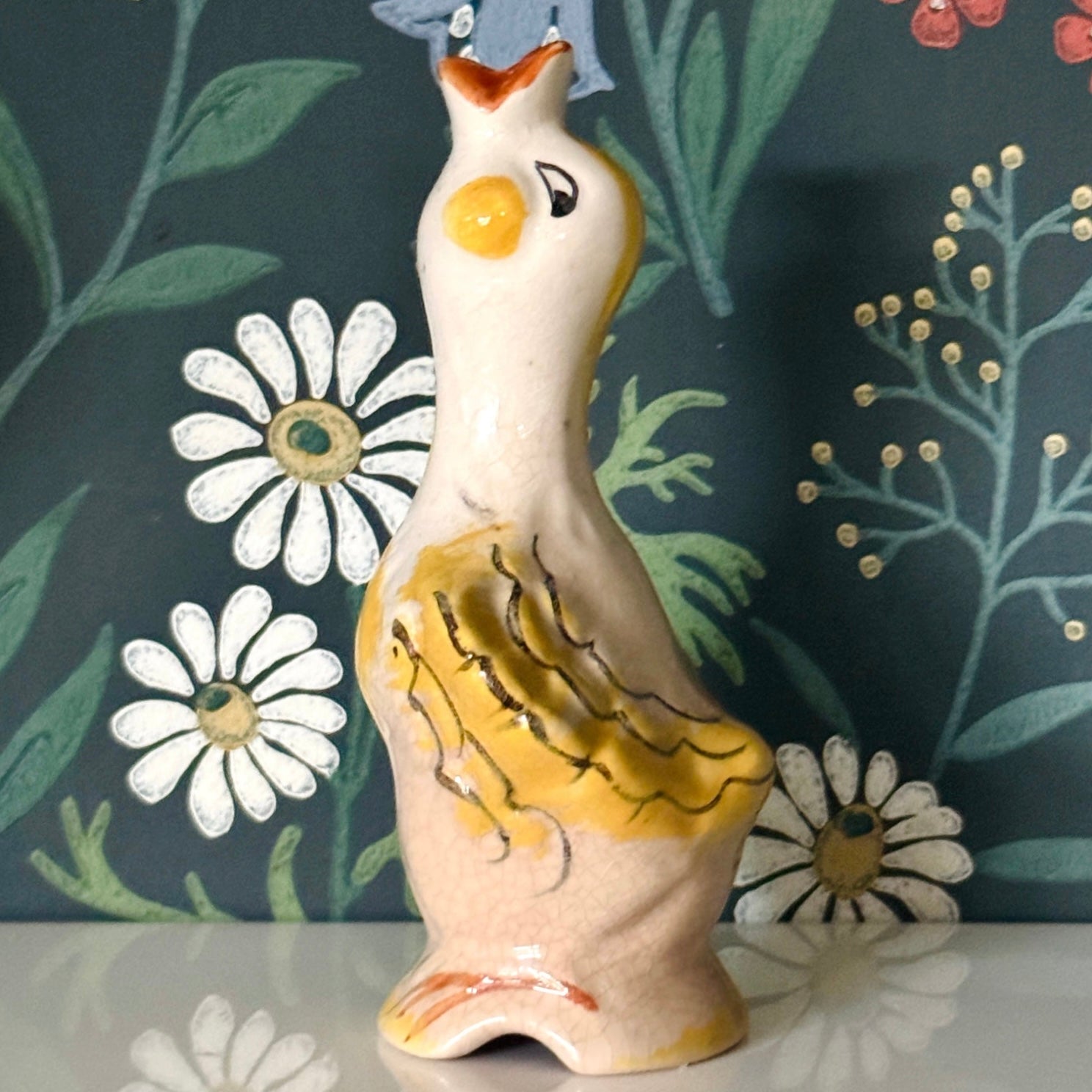 Pretty dcorative peach and yellow vintage pie bird kitchen collectable against heirage floral wallpaper background