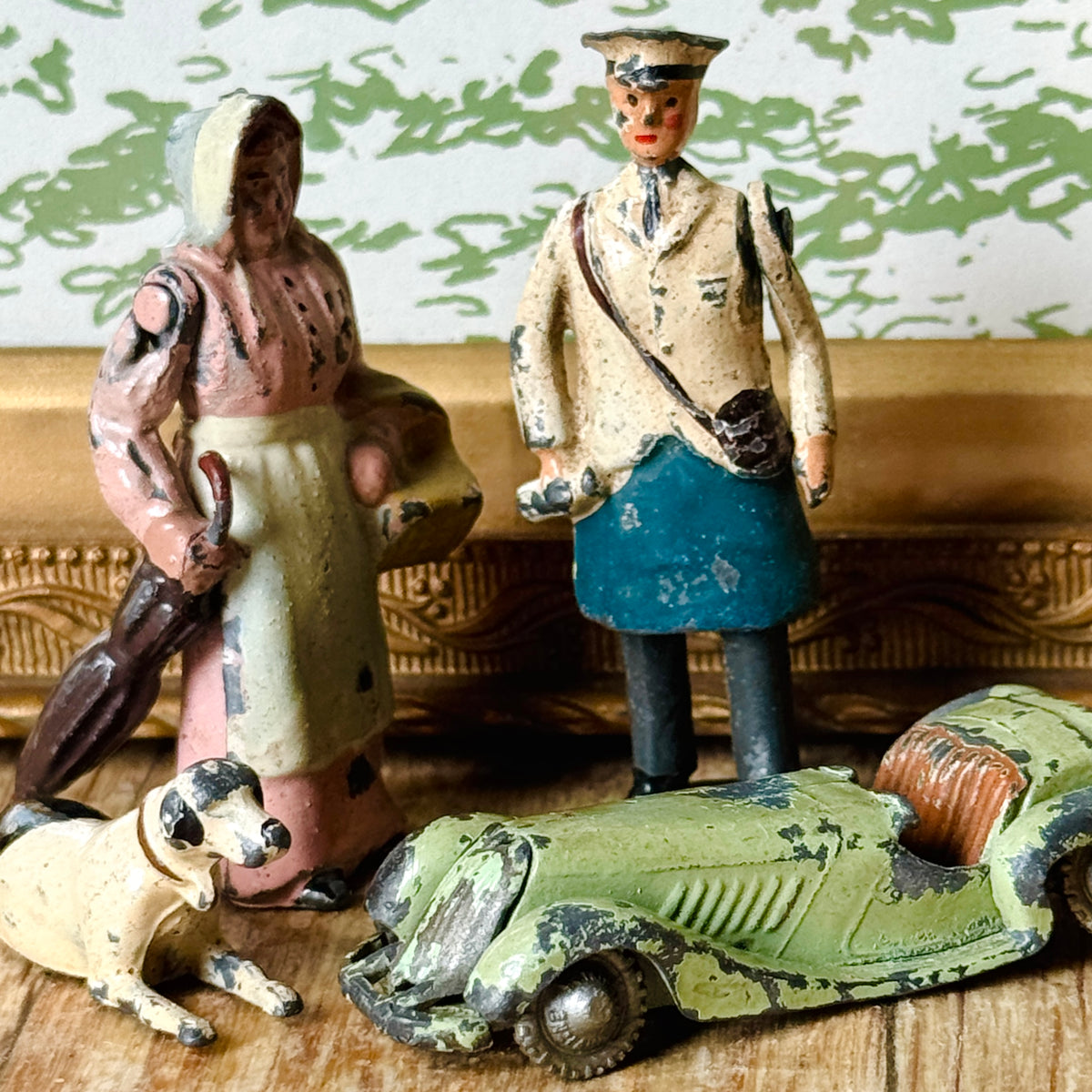 A collection of vintage Britains lead miniature figurines styled together on a shelf, featured in Whispers in Lead | The Magic of Britains Lead Toys.