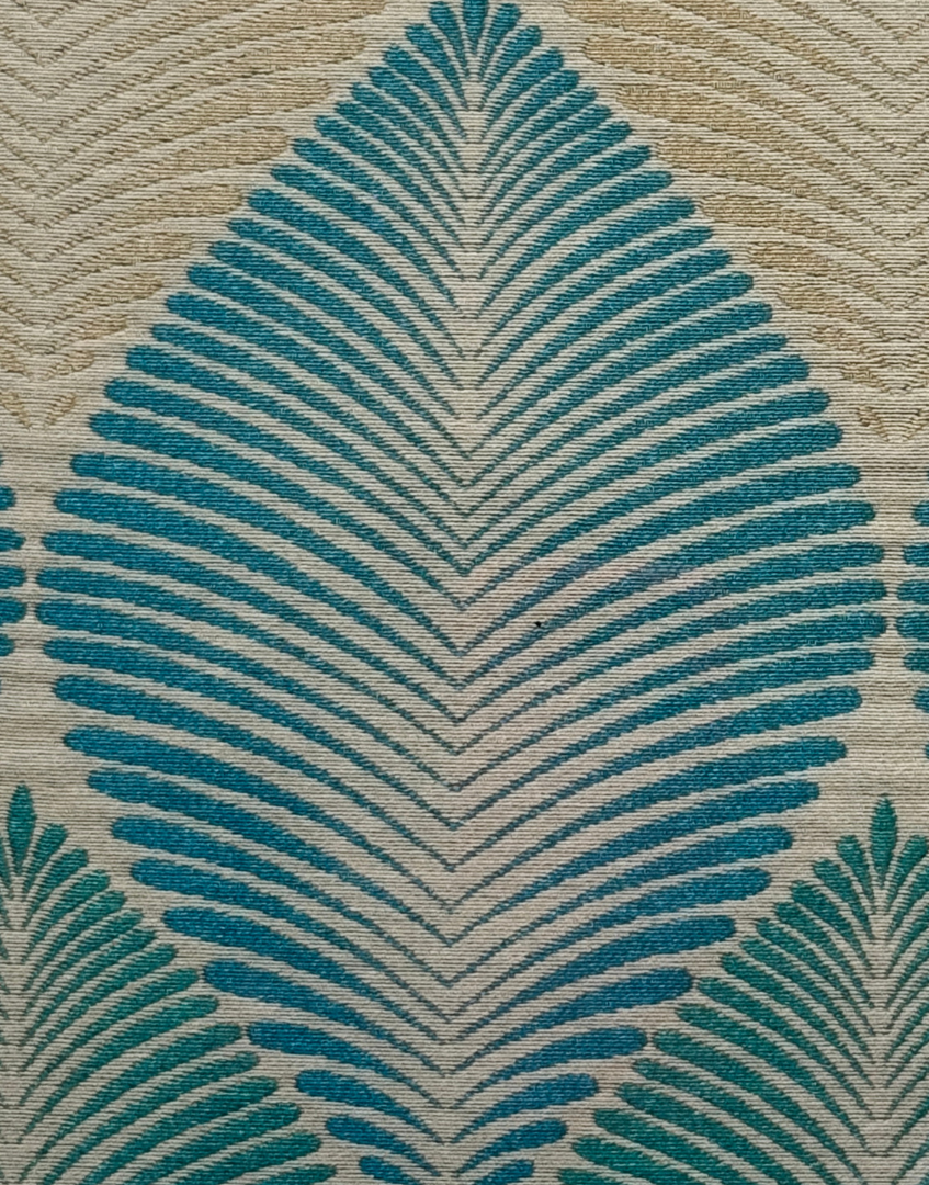 Close up of blue and beigegeometric leaf pattern textile