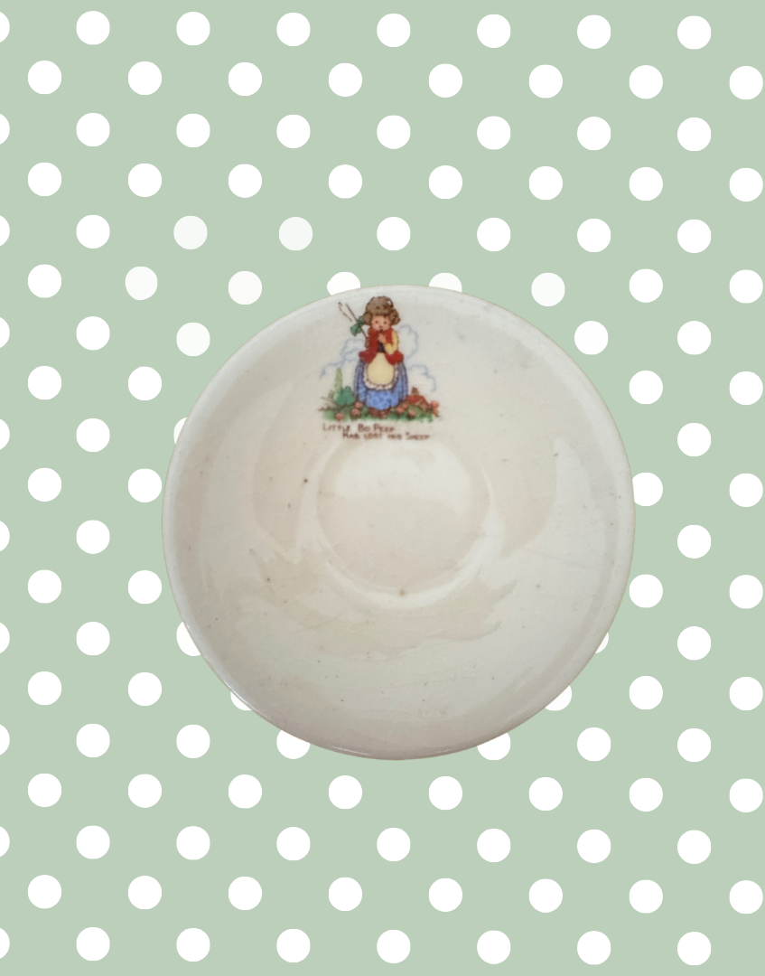 vintage childs playset saucer with nursery illustration
