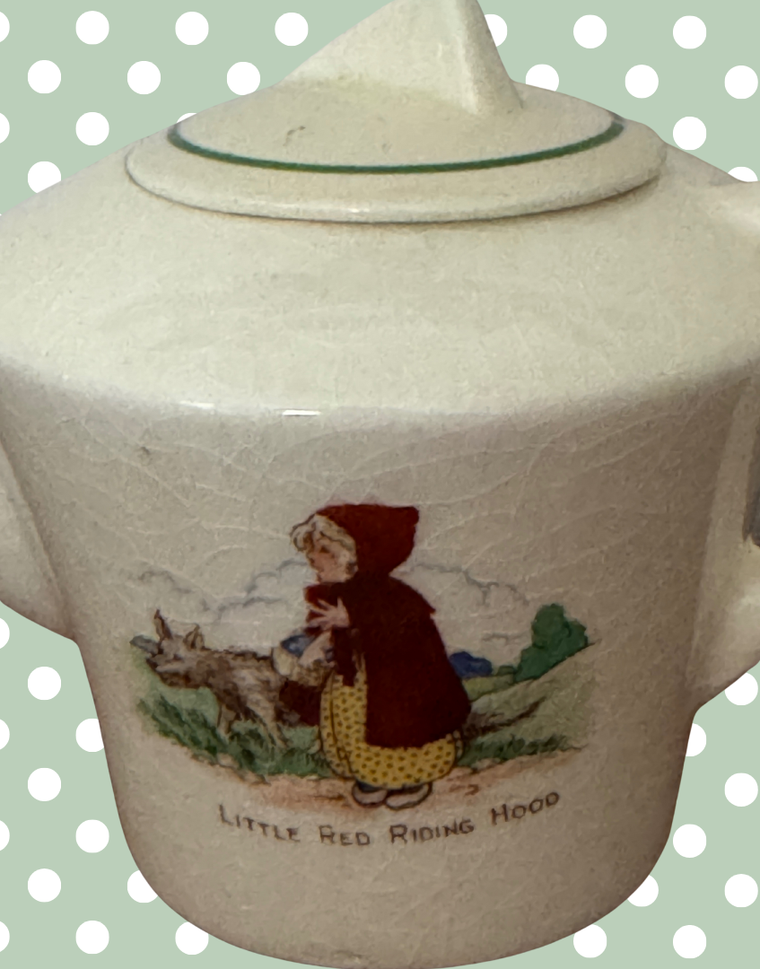 close up of little red riding hood decoration on 1940s childs play teapot
