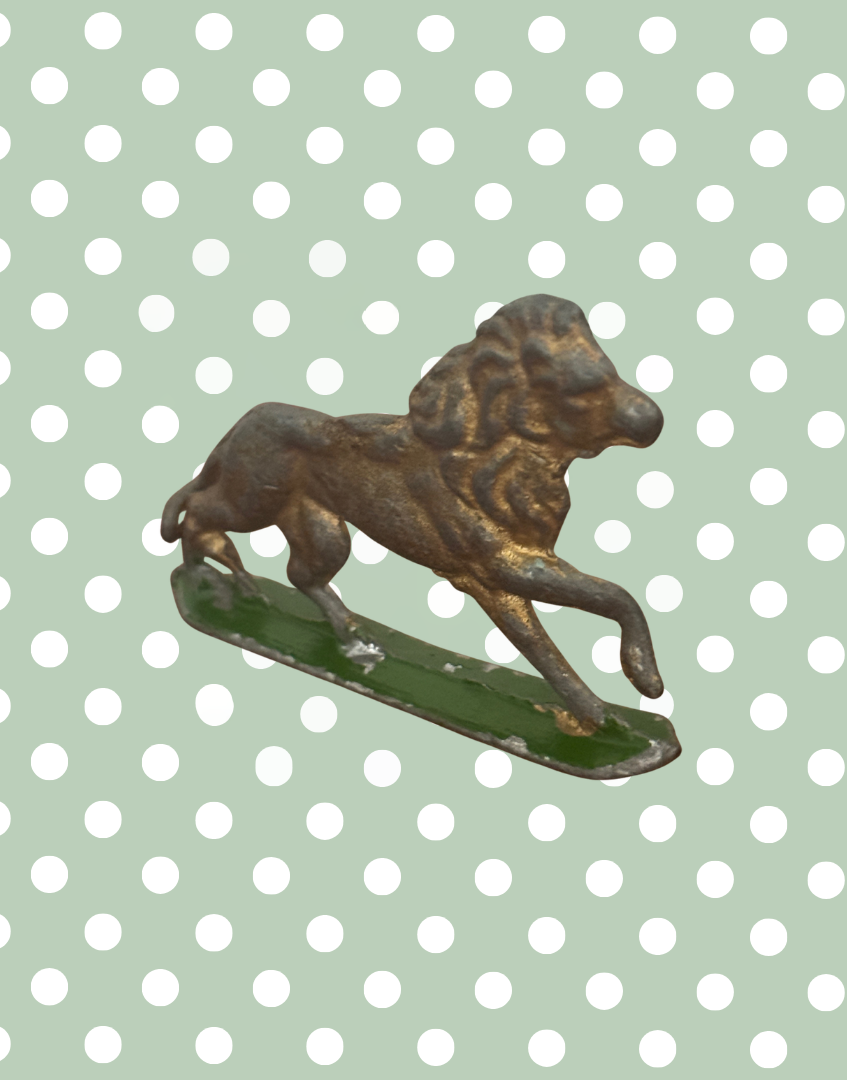 front facing vintage metal lion figurine