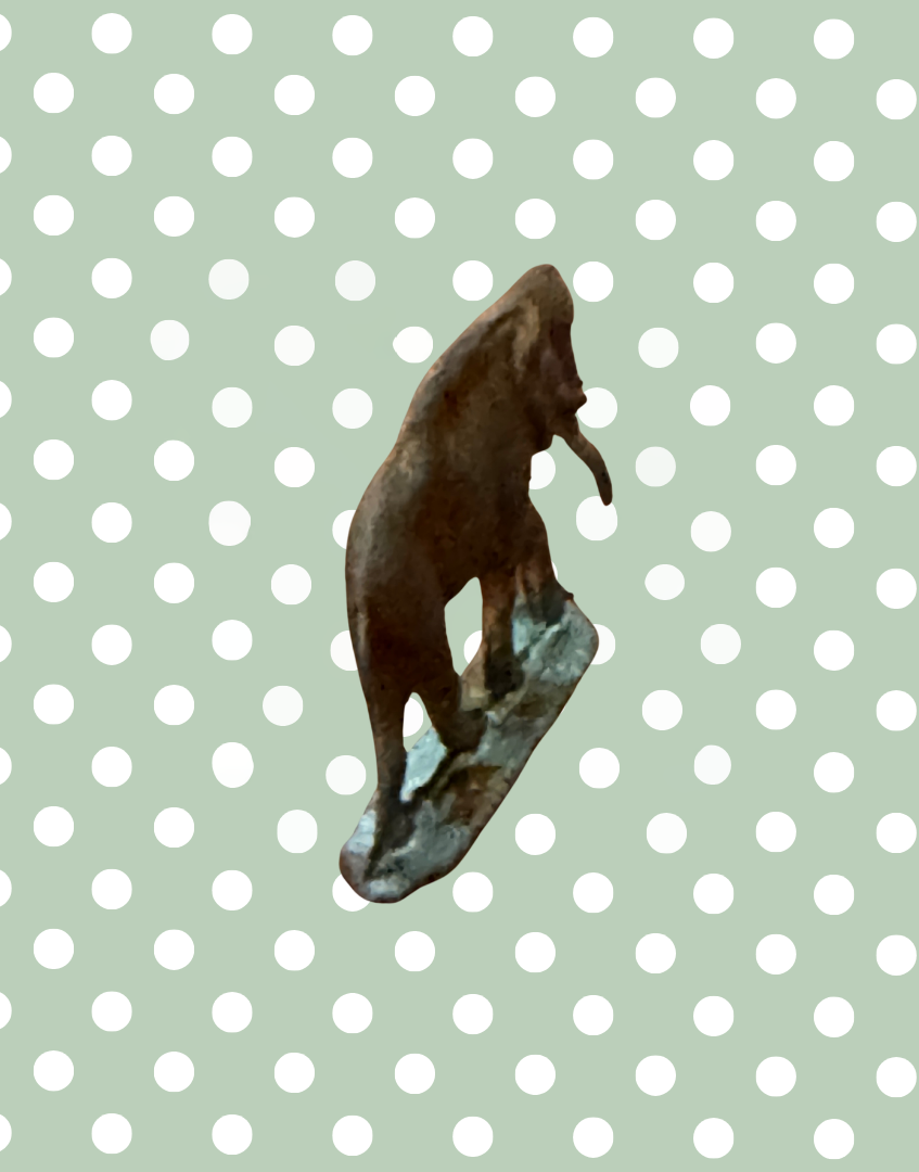 back view of vintage lead toy elphant ephemera