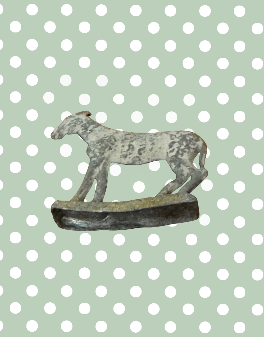 underside of miniature vintage lead britains goat figurine on stand