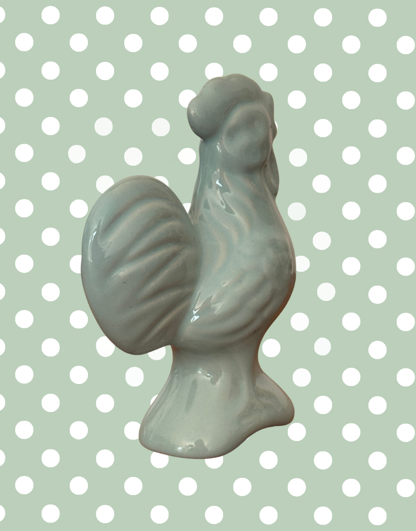 Side back view of blue vintage bird pie baking tool