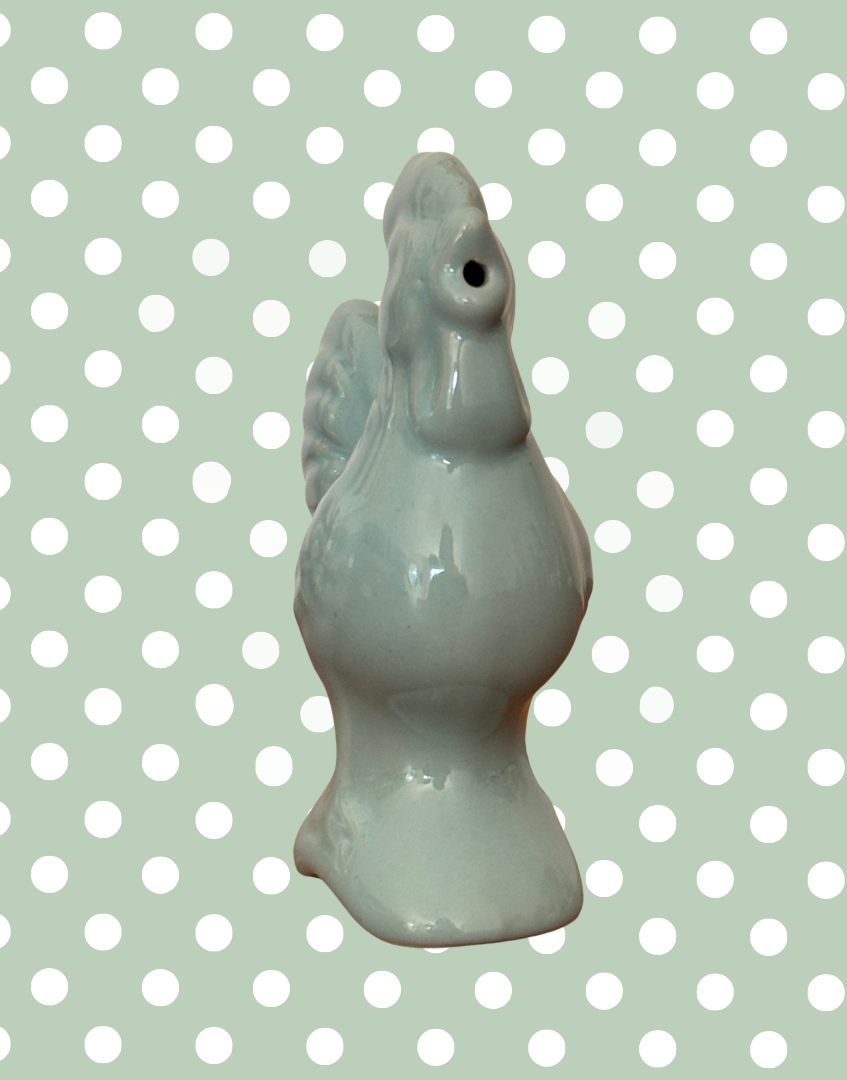 Front fiew of blue chicken pie bird to show steam vent in beak
