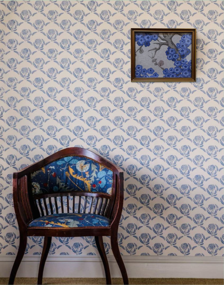 Blue and white interior hallway with antique dark wod cair and pretty gold vintage framed blue floral artwork