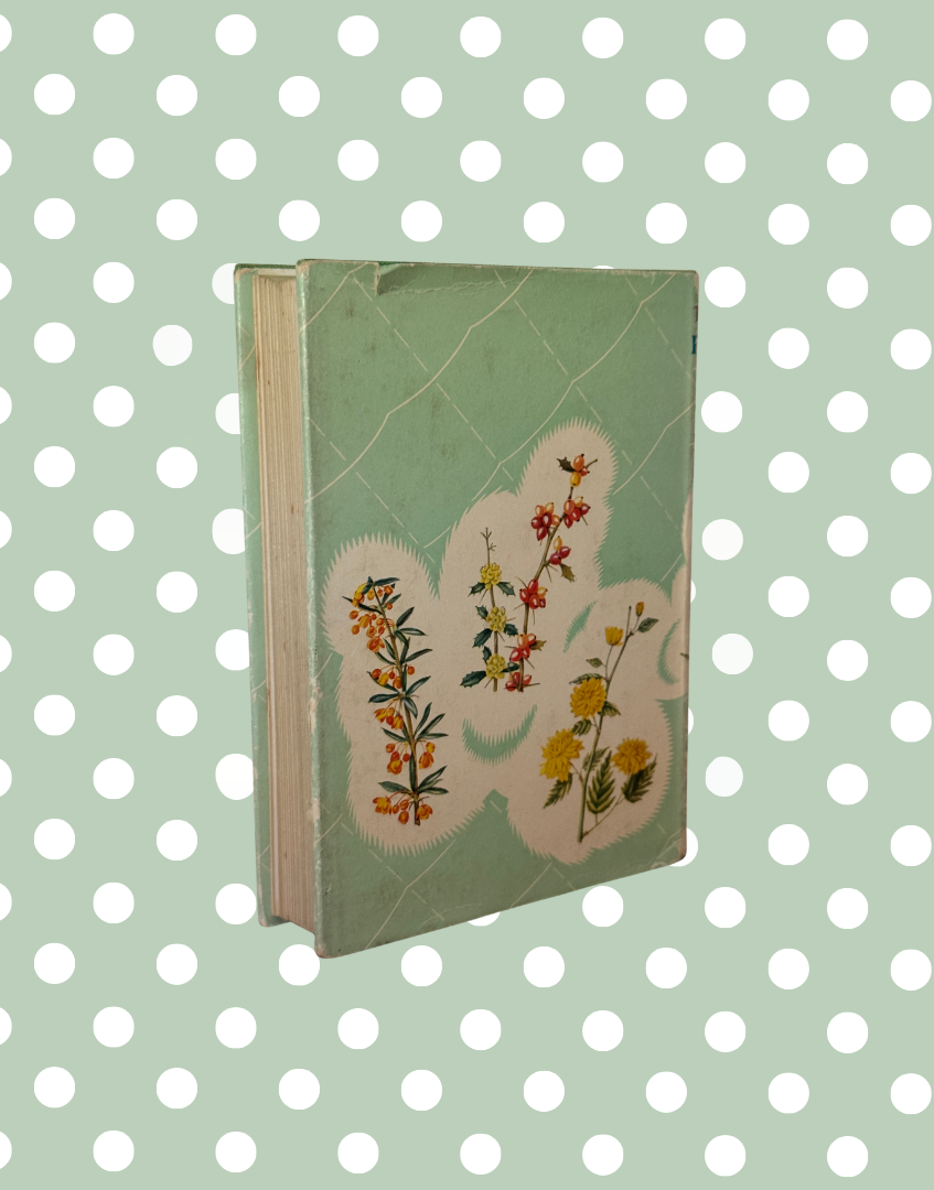 Rear view of vintage botanical gardening reference book with aged dust jacket