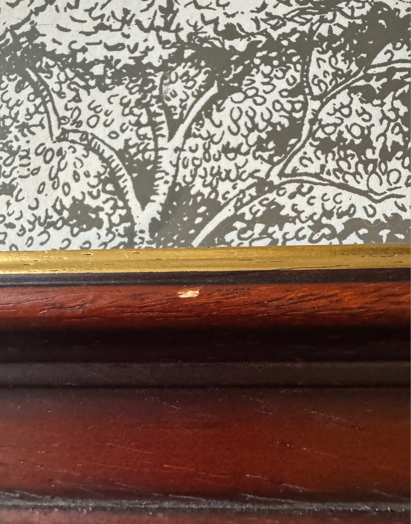 Close up of Sanderson 'Woodland Toile - Charcoal & Cream' Print in Vintage Dark Wood Gold Frame