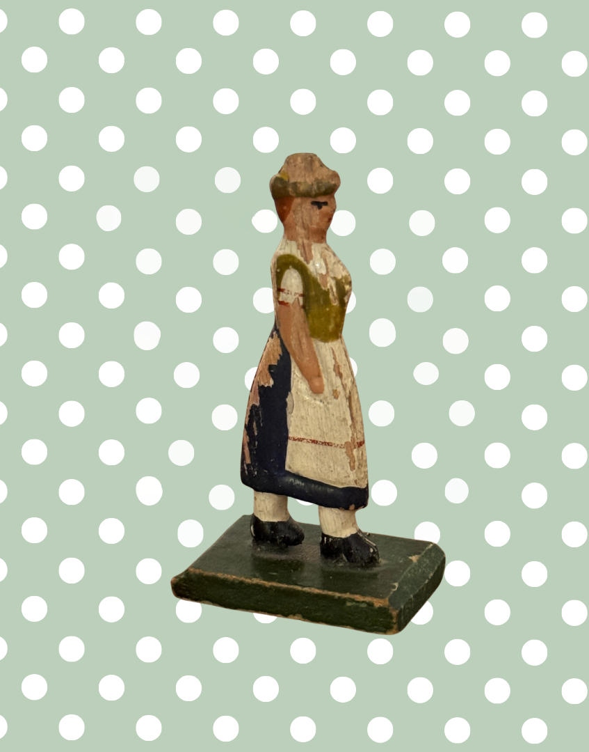 Product description:

A traditional flat wooden toy figure from the Erzgebirge region of Germany, featuring a hand-painted country farm woman. Lovely naive style and gentle signs of age make this a collectible piece of folk toy history.



Product details:

• Origin: Erzgebirge, Germany

• Material: Hand-painted wood

• 1930s



Condition:

Good vintage condition with light paint loss to back. Please refer to images.



Product dimensions:

Height: 5.5cm

Width: 1.5cm