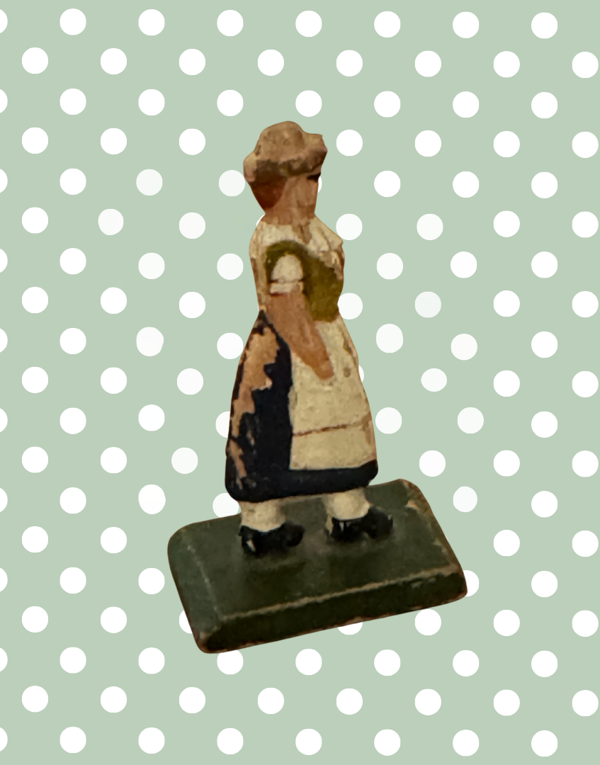 Product description:

A traditional flat wooden toy figure from the Erzgebirge region of Germany, featuring a hand-painted country farm woman. Lovely naive style and gentle signs of age make this a collectible piece of folk toy history.



Product details:

• Origin: Erzgebirge, Germany

• Material: Hand-painted wood

• 1930s



Condition:

Good vintage condition with light paint loss to back. Please refer to images.



Product dimensions:

Height: 5.5cm

Width: 1.5cm