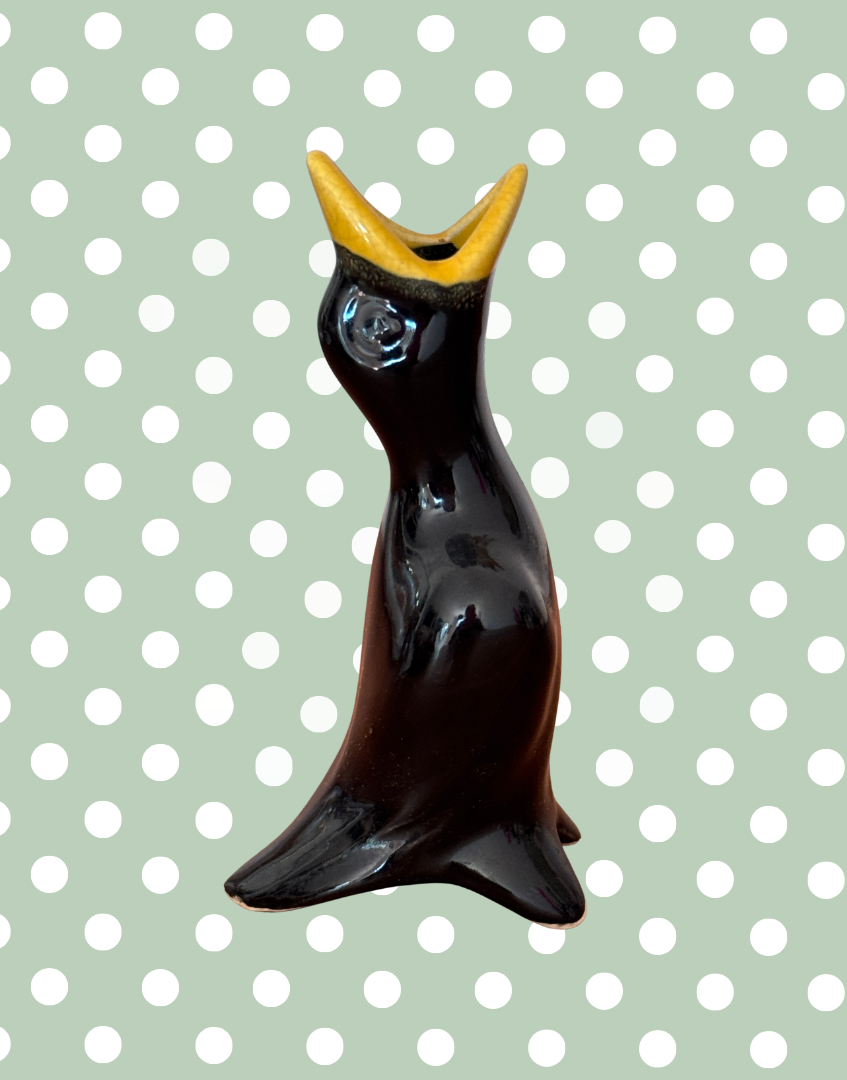 Decorative classic vintage pie funnel shaped as a black bird
