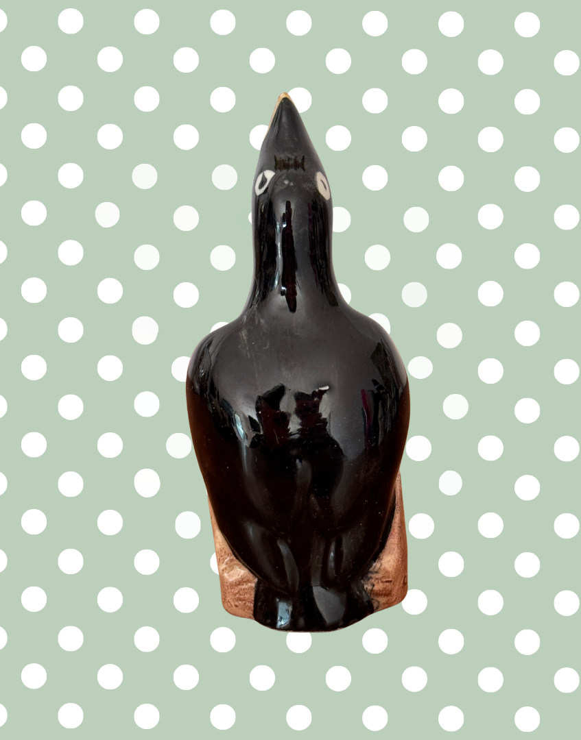 Back view of ceramic black bird pie funnel