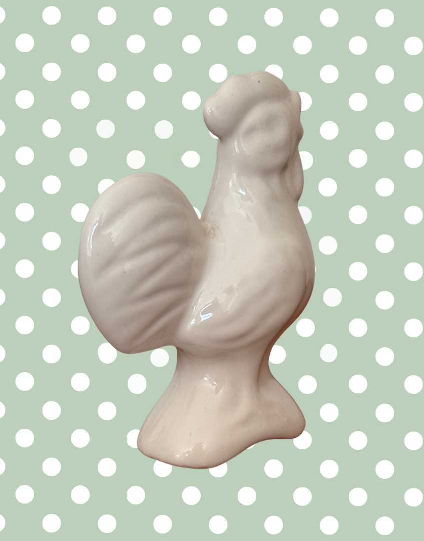 Back side view of white bird shaped pie vent