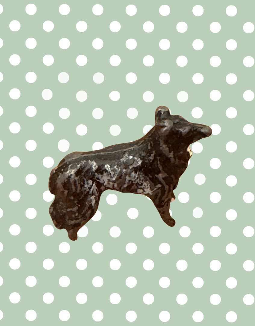 side view showing agewear and patina on britains miniature farm dog