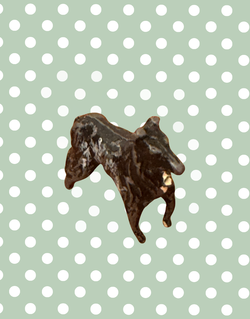 front side view of antique lead dog toy