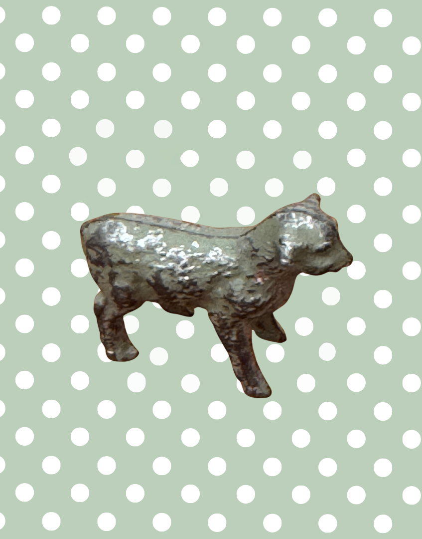 side view of vintage lead lamb collectable