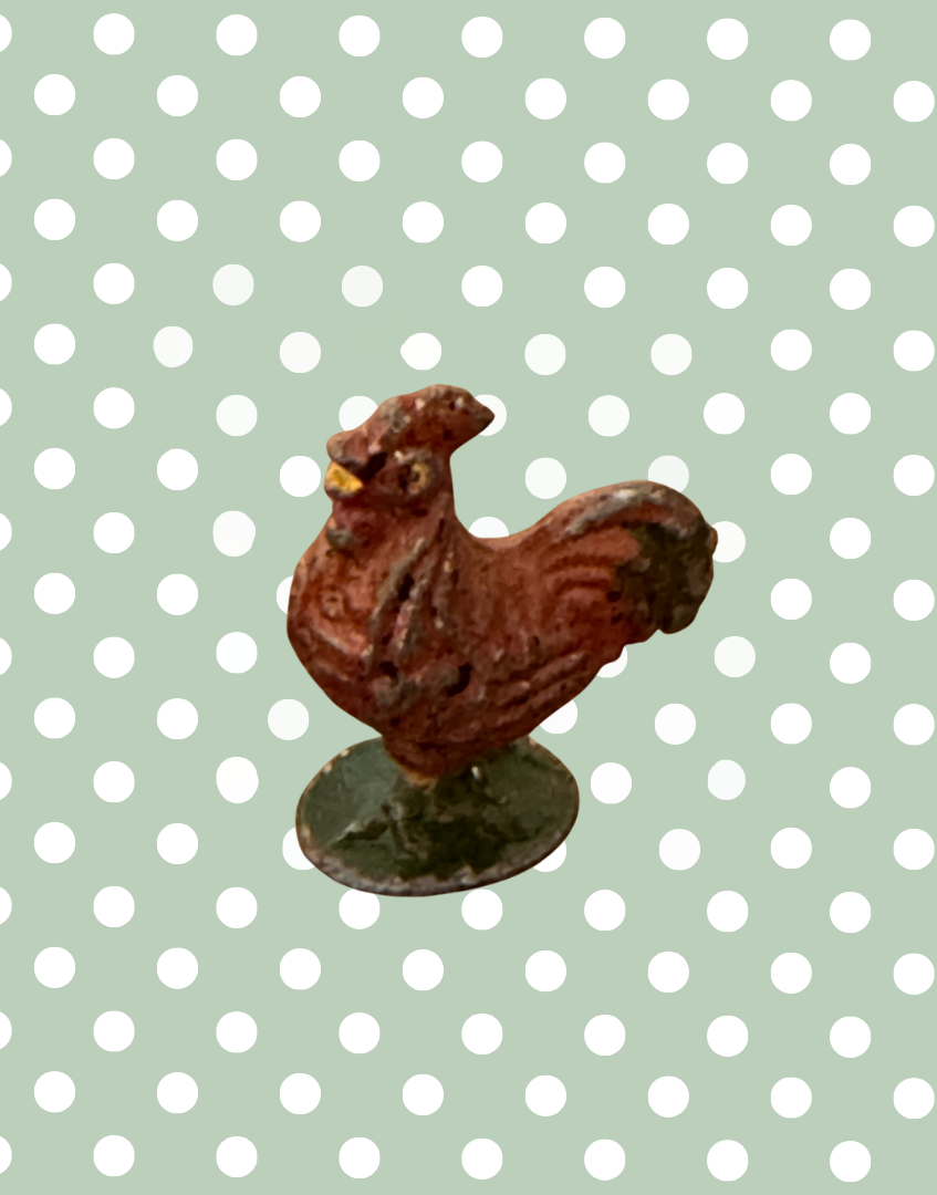 side view of brown cockerel small scale antique lead farm toy