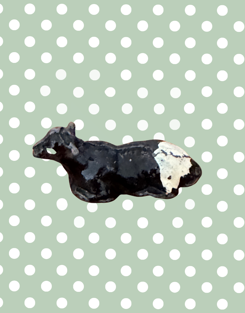 side view of collectable calf lead farm figurine