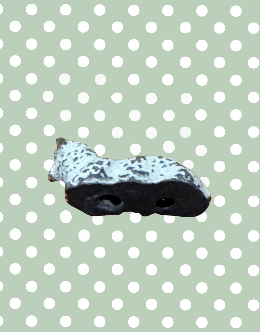 underside view of small white lamb lead toy figure